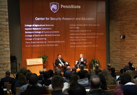 Photo of two men giving a presentation for the Center for Security Research and Education.