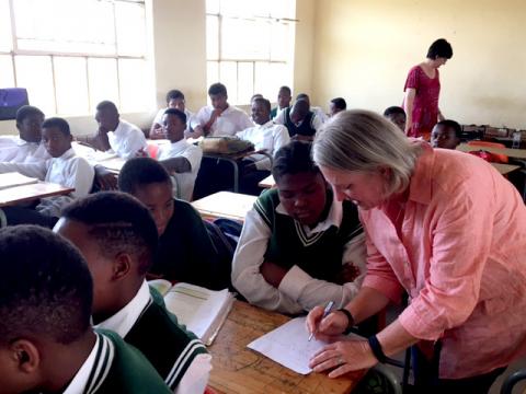 Photo of P. Karen Murphy with students in South Africa.