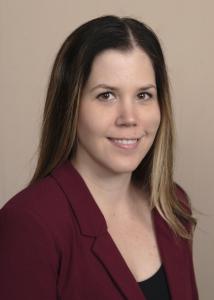 Headshot of Beth Long, medium length brown hair with burgandy blouse.