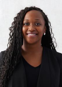 Headshot of Christa Mahlabo, Long black hair, black shirt, black blazer