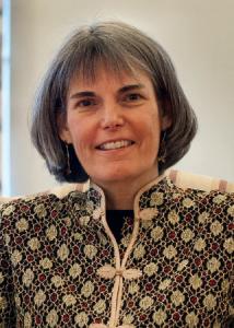 Headshot of Susan McHale with mid-length, grey hair wearing patterned top.