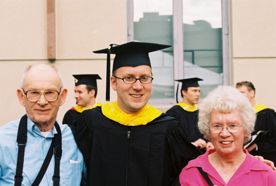 College graduate and his parents.