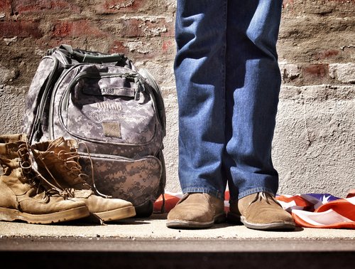 Man with military boots and backpack.