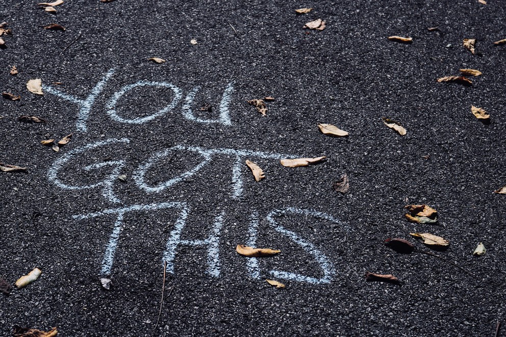 "You Got This" in chalk on road.