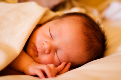 Photo of a sleeping newborn baby.