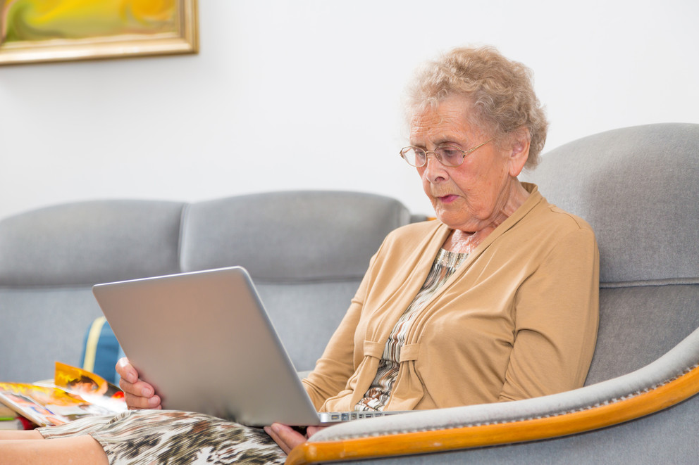 Senior using a laptop computer