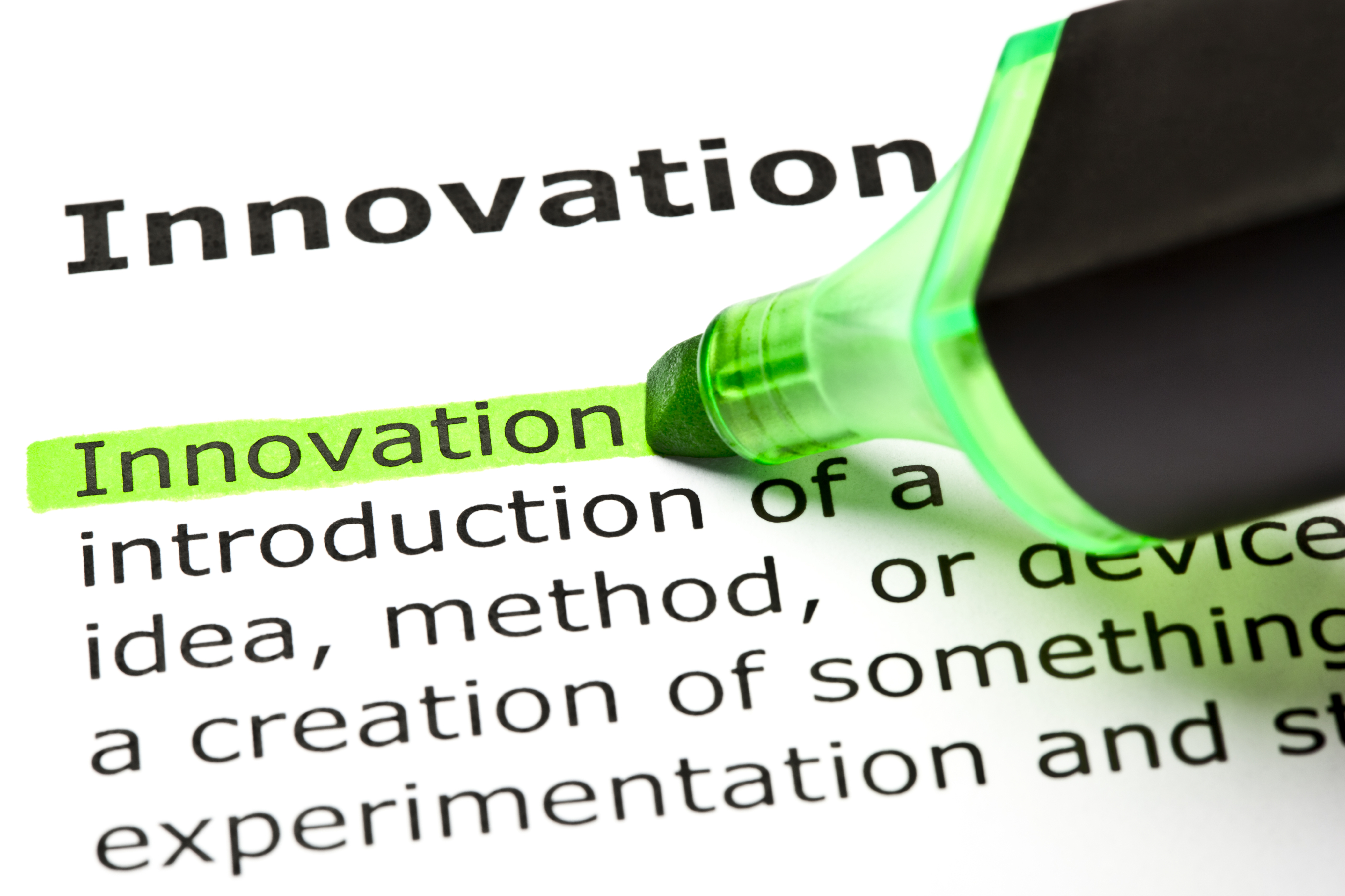 Photo of the written definition of innovation, with a green highlighter marking it.
