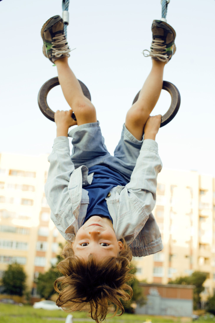 Child hanging upside down