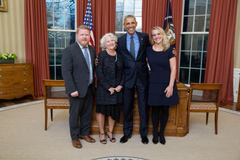 Photo of Michael Donovan with President Obama and two others.