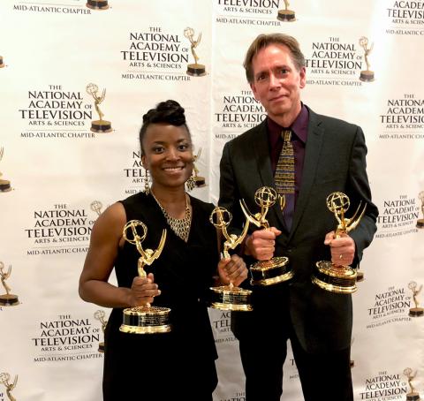Cheraine Stanford and Kristian Berg holding Mid-Atlantic Emmy awards.