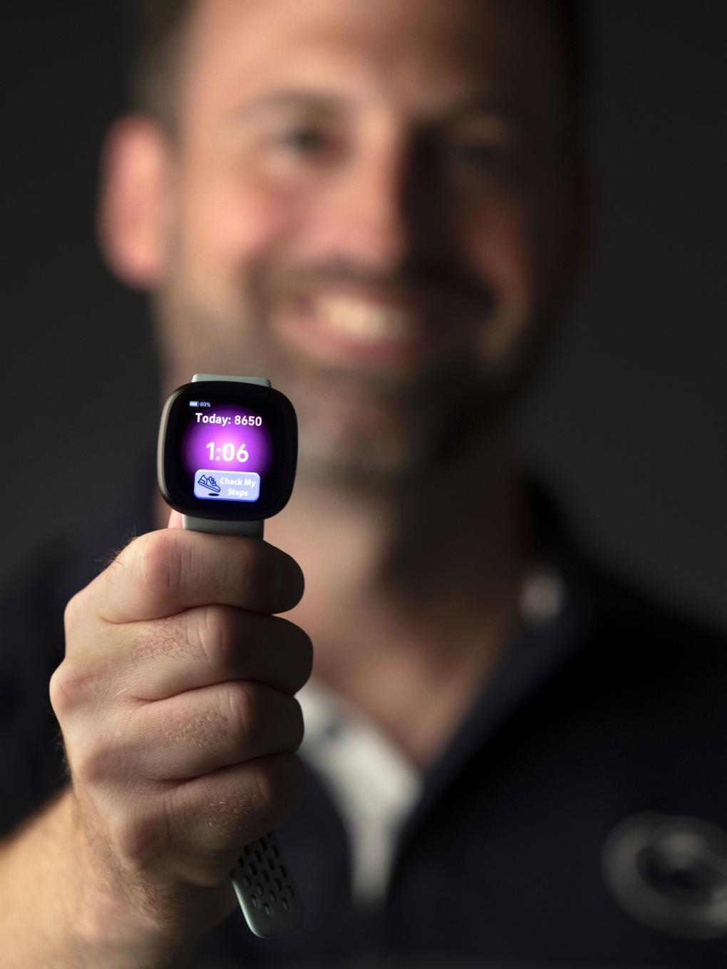 Researcher with FitBit watch