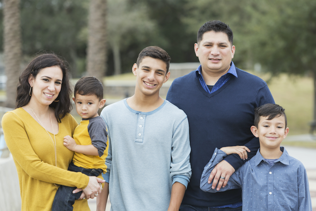 Hispanic family with three sons.