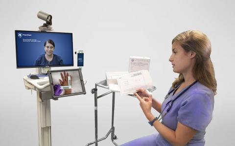 Nurse advising another nurse via telehealth technology
