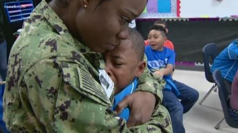 Photo of a military mom hugging her young son.