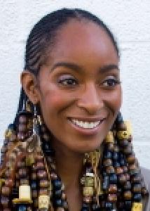 Headshot of Jeanine Staples, a black woman with longe braids.