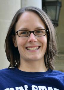 Headshot of Jessica Lougheed with short brown hair, glasses, and blue Penn State t-shirt.