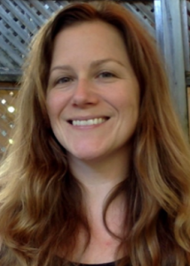 Headshot of Kathleen Gates with long brown hair and dark top.