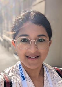 Headshot of Priyanka Paul with black hair, glasses, and speckled blouse.