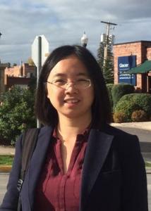 Headshot of Siwei Liu with black hair, glasses, maroon blouse, and black jacket.