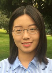 Headshot of Yanling Li with black hair, glasses, and blue and white striped blouse.
